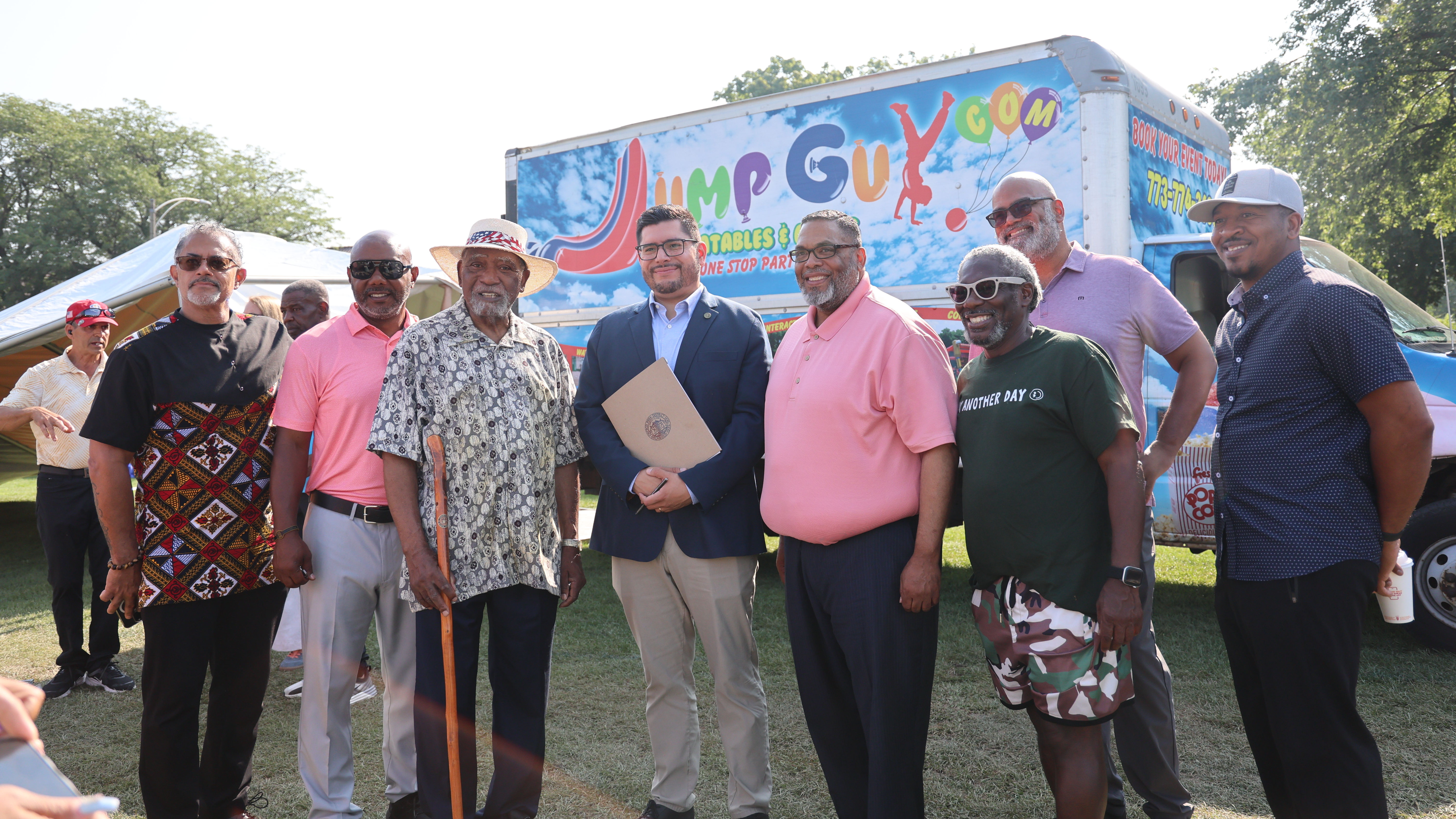 Group photo of men in front of a Jump Guy truck.